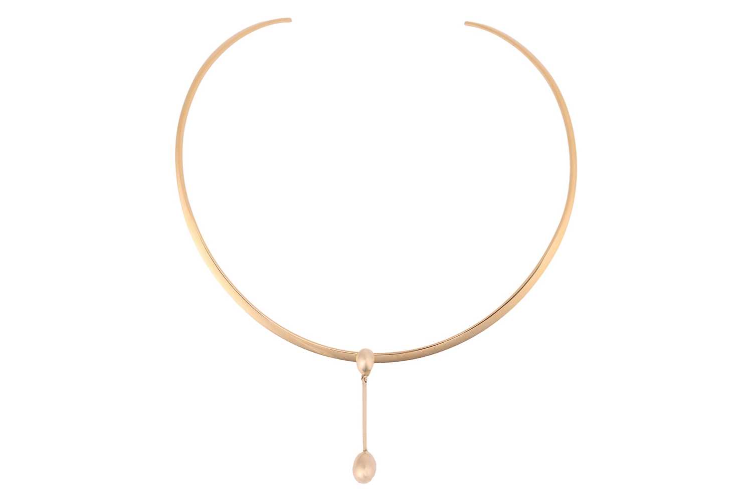 Lot 124 - A torque necklace, the polished and tapered...