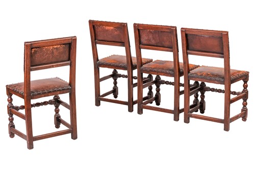 Lot 97 - A set of six Cromwellian-style oak and leather...