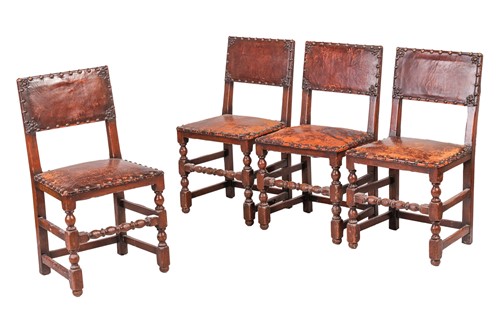 Lot 97 - A set of six Cromwellian-style oak and leather...