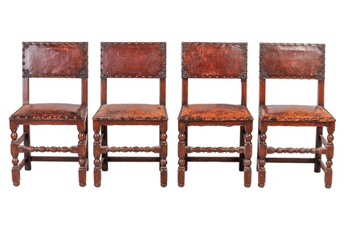 Lot 97 - A set of six Cromwellian-style oak and leather...