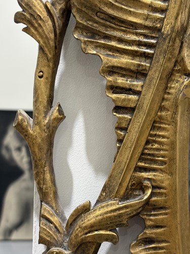 Lot 141 - A 19th-century oval carved wood and gilt gesso...