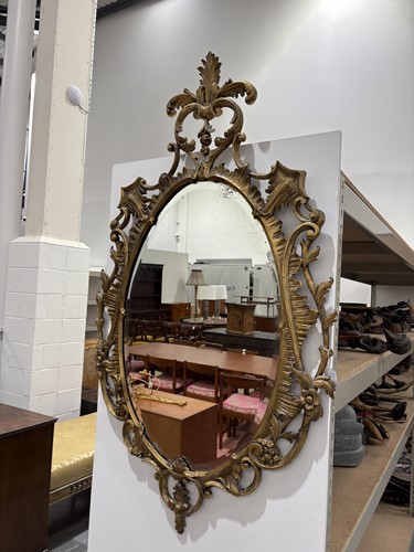 Lot 141 - A 19th-century oval carved wood and gilt gesso...