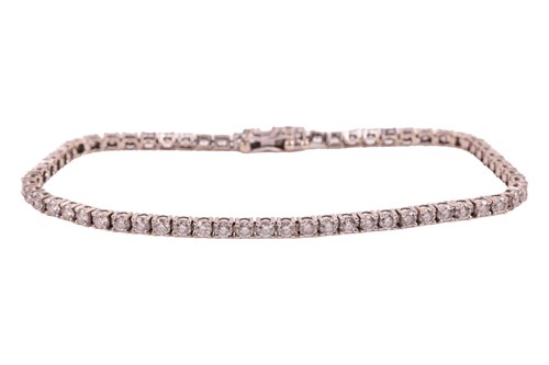 Lot 71 - A diamond-set line bracelet, with...