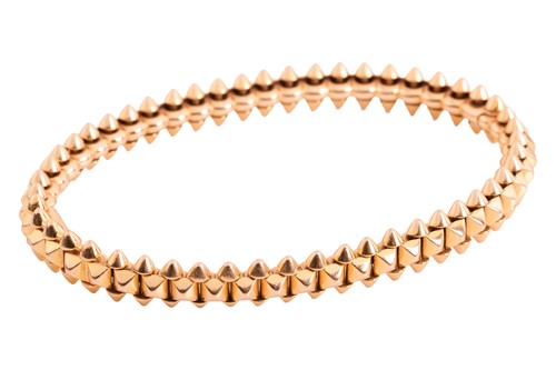 Lot 170 - Cartier - a Clash de Cartier hinged bangle,...