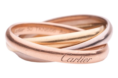 Lot 174 - Cartier - a trinity ring in 18ct gold,...