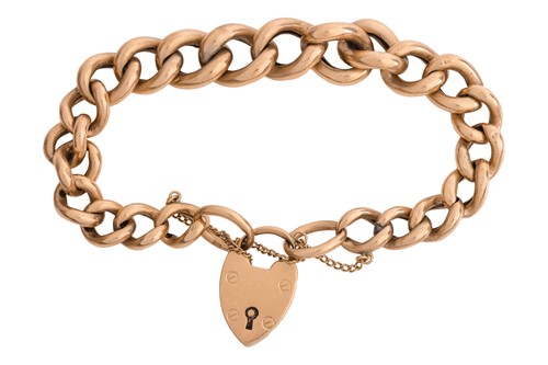 Lot 237 - A curb chain bracelet with a heart padlock...