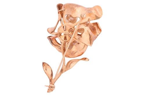Lot 86 - A pearl-set floral brooch, of a stylised...