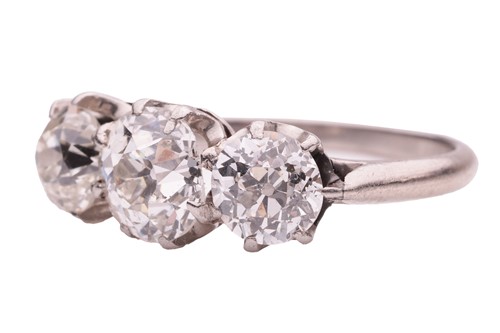 Lot 50 - An old-cut diamond trilogy ring, claw-set with...