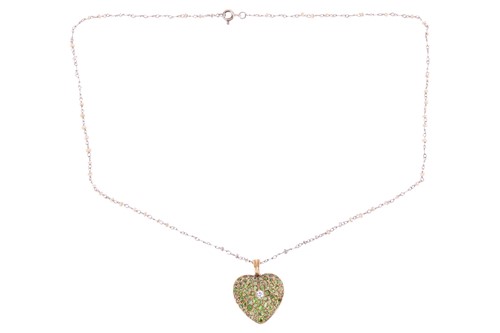 Lot 190 - A heart locket pendant on chain set with...