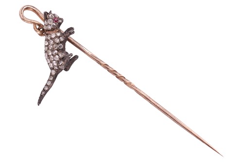 Lot 15 - An Edwardian gem-set cat stick pin, the...