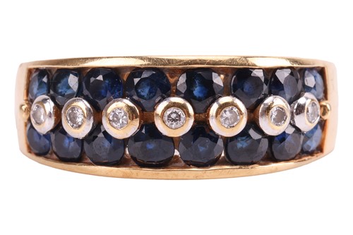 Lot 212 - A sapphire and diamond ring, a central line of...