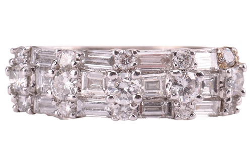 Lot 131 - A diamond-set ring, featuring baguette-cut and...