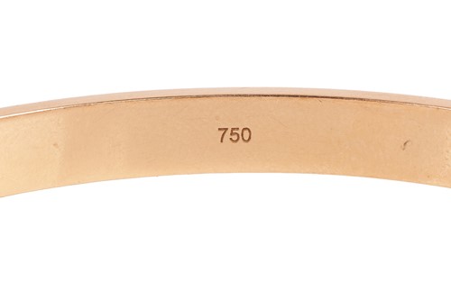 Lot 178 - Cartier - a 'LOVE' bangle in 18ct yellow gold,...