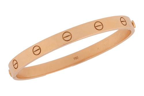 Lot 178 - Cartier - a 'LOVE' bangle in 18ct yellow gold,...