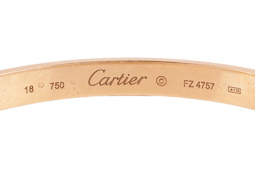 Lot 178 - Cartier - a 'LOVE' bangle in 18ct yellow gold,...