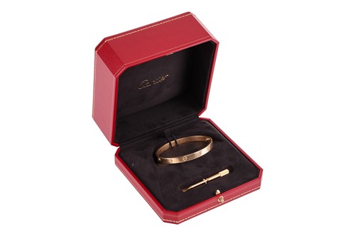 Lot 178 - Cartier - a 'LOVE' bangle in 18ct yellow gold,...