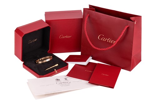 Lot 178 - Cartier - a 'LOVE' bangle in 18ct yellow gold,...