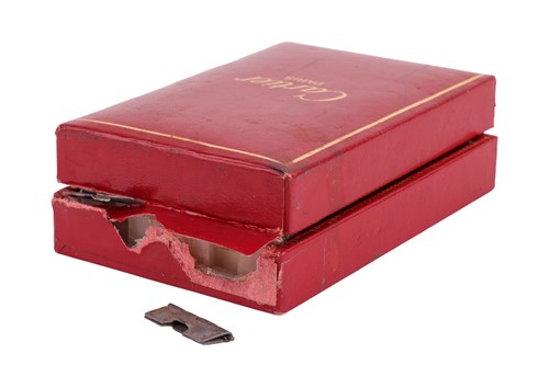 Lot 249 - Cartier - a diamond-set gas lighter of rounded...