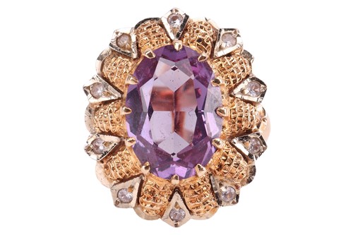 Lot 135 - A synthetic colour change sapphire and white...