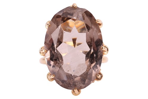 Lot 144 - A smoky quartz dress ring, the smoky quartz...