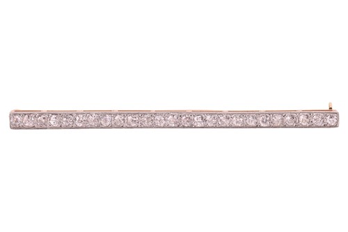 Lot 27 - A diamond set bar brooch, pavé-set with twenty-...