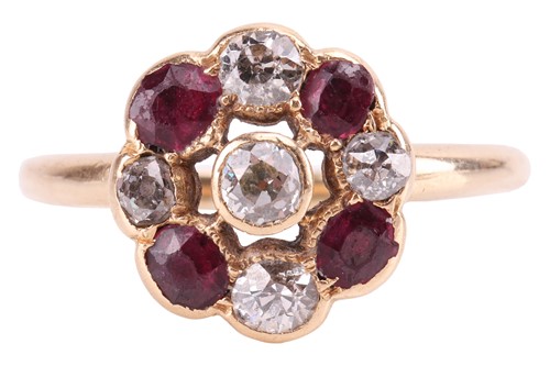 Lot 193 - A ruby and diamond cluster ring, set with four...