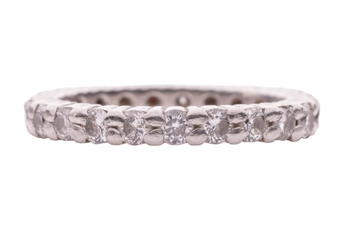 Lot 112 - A diamond eternity ring, with an estimated...