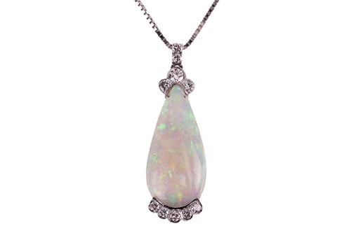 Lot 121 - A large opal and diamond pendant on chain,...