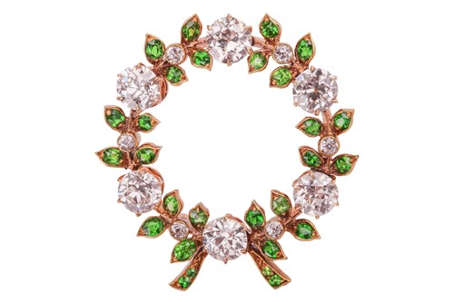 Lot 222 - Marcus & Co. - a diamond and demantoid garnet...