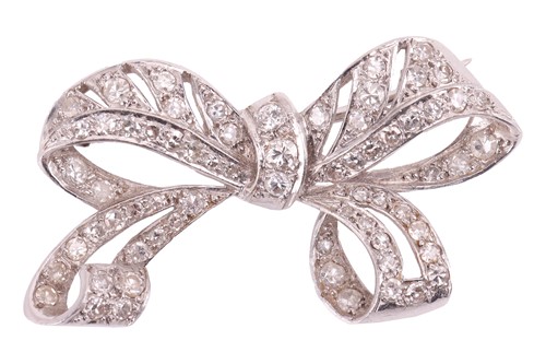 Lot 6 - A diamond-set bow brooch of pierced design,...