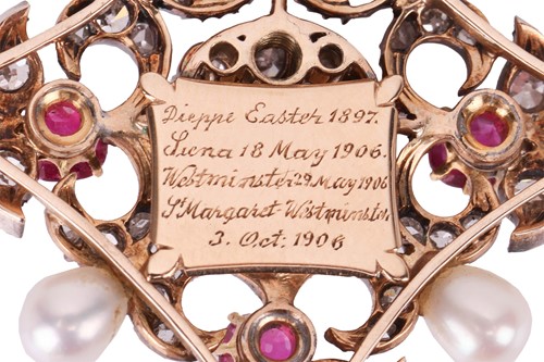 Lot 167 - A diamond, ruby and natural pearl pendant on...
