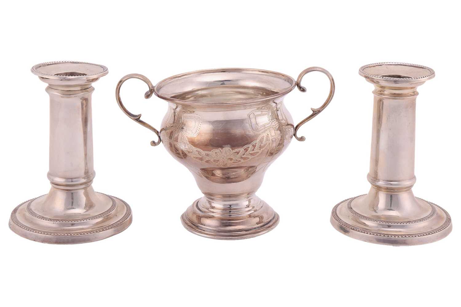 Lot 104 - A pair of Victorian silver dwarf candlesticks...