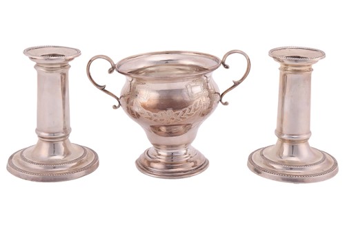 Lot 104 - A pair of Victorian silver dwarf candlesticks...