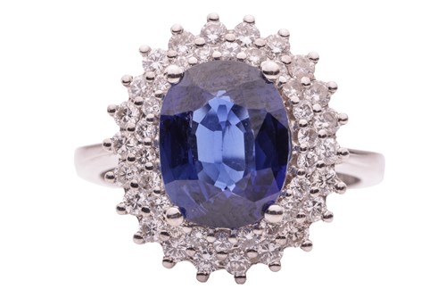 Lot 36 - A synthetic sapphire and diamond cluster ring,...