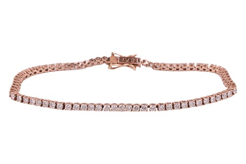Lot 240 - A diamond line bracelet, comprising...