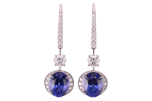 Lot 50 - A pair of tanzanite and diamond pendant...