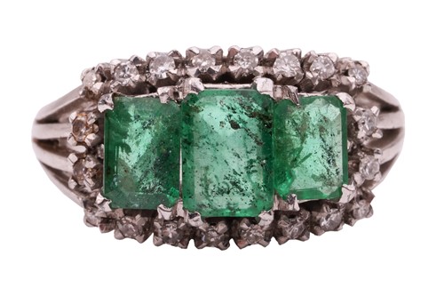 Lot 156 - An emerald and diamond half-hoop ring, centred...