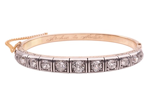 Lot 97 - A Victorian diamond-set hinged bangle, with an...