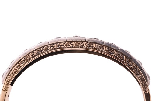 Lot 97 - A Victorian diamond-set hinged bangle, with an...