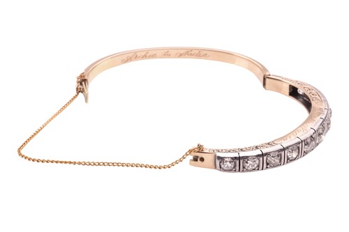 Lot 97 - A Victorian diamond-set hinged bangle, with an...
