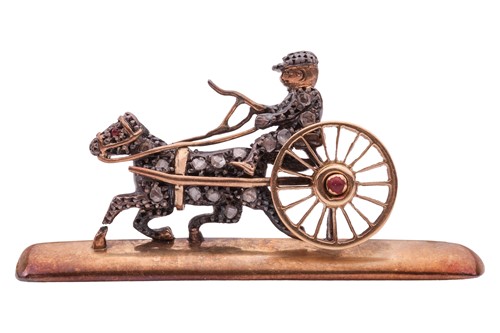 Lot 101 - A gem-set carriage brooch, the horse-drawn...