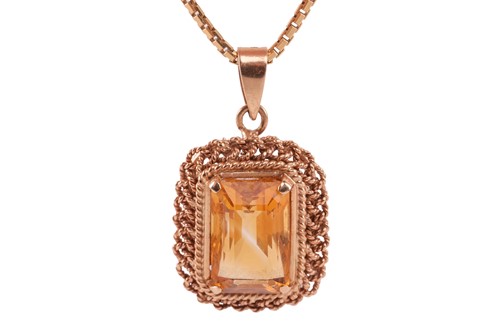Lot 87 - A citrine pendant on chain, featuring a...