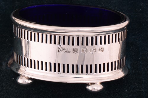 Lot 148 - A cased pair of silver goblets, with a band to...