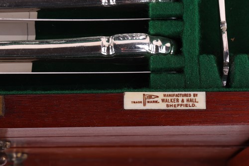 Lot 83 - Two silver-plated canteens in brass-bound oak...