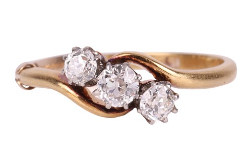 Lot 161 - A three-stone diamond crossover ring,...