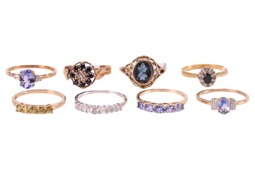 Lot 30 - A collection of eight gem-set rings; to...