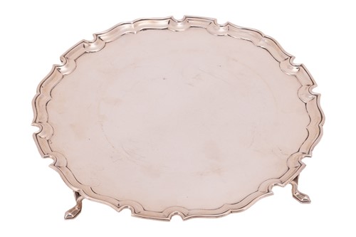 Lot 98 - A silver salver by Edward Barnard & Sons Ltd.,...