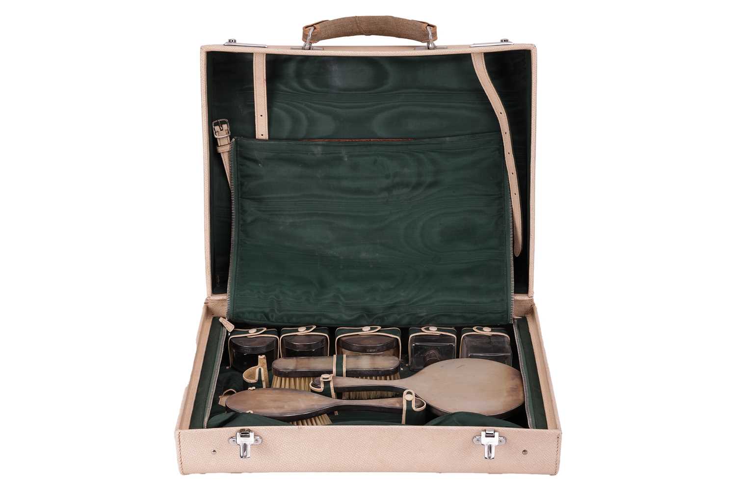 Lot 123 - A silver dressing table set in a fitted...