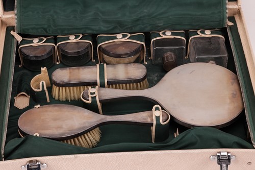 Lot 123 - A silver dressing table set in a fitted...