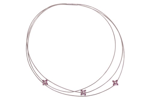 Lot 179 - Boodle & Dunthorne - a pink sapphire and...